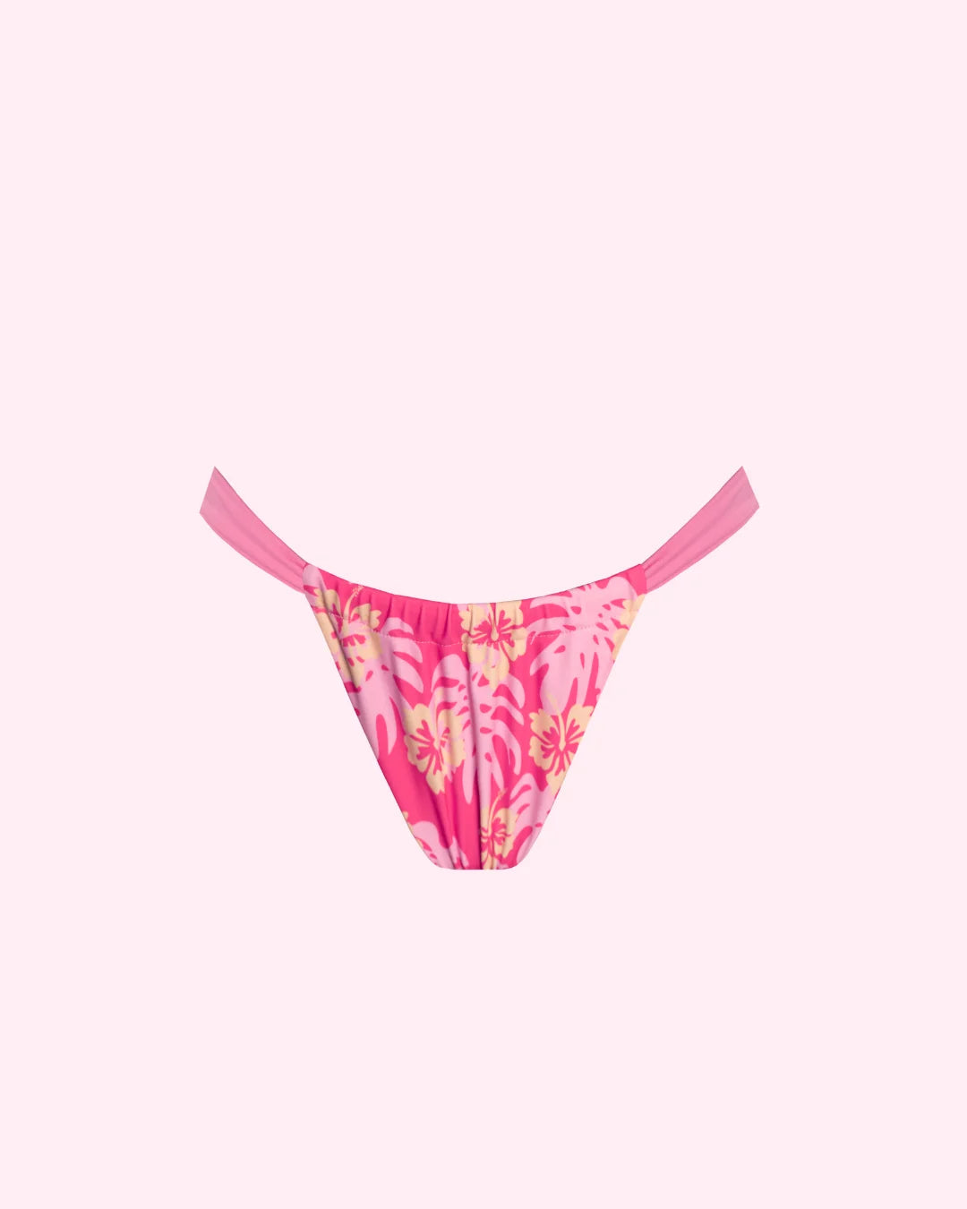 A coral pink adjustable style bikini bottoms with light pink and yellow hibiscus design 