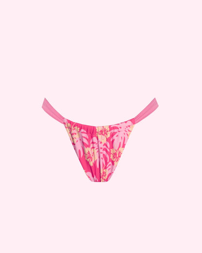 A coral pink adjustable style bikini bottoms with light pink and yellow hibiscus design 
